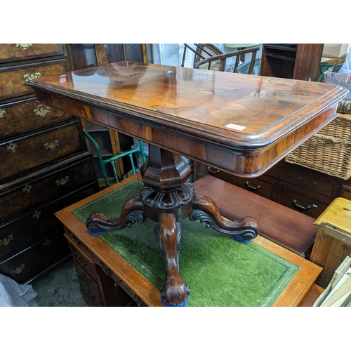 537 - A William IV rosewood swivel top folding card table, fluted octagonal baluster column support above ... 