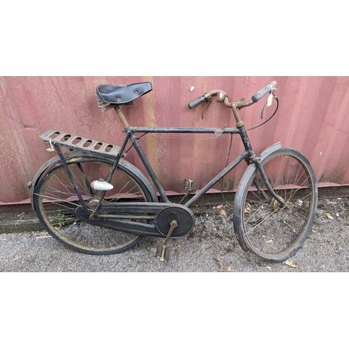 393 - Circa 1930, a vintage gents bicycle in black colourway, possibly a Raleigh, with a Reece black leath... 