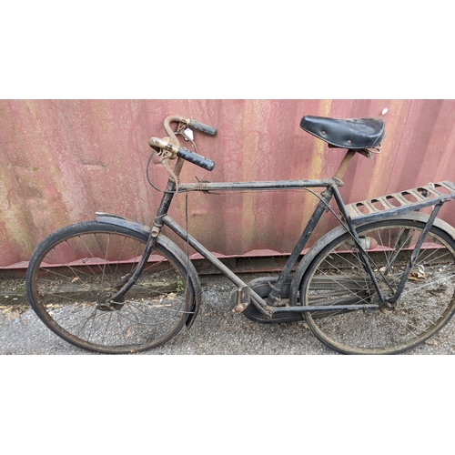 393 - Circa 1930, a vintage gents bicycle in black colourway, possibly a Raleigh, with a Reece black leath... 