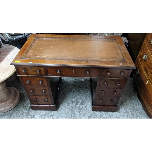 468 - A Victorian mahogany twin pedestal desk, the top with inset leather scriber, one long flanked by two... 