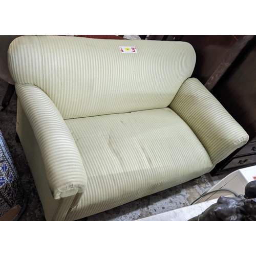 469 - An Edwardian upholstered drop and two seater sofa on mahogany short square front legs Location:G
If ... 