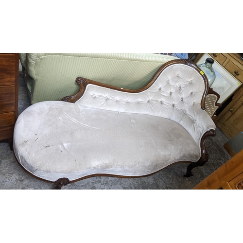 471 - A Victorian carved mahogany framed and upholstered chaise longue on French cabriole carved front leg... 