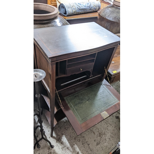 525 - Edwardian inlaid mahogany ladies writing desk, slightly serpentine fronted, fall flap revealing a fi... 