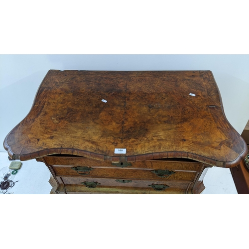 168 - A 18th century continental burr walnut bombe chest of three graduating drawers, having marquetry inl... 