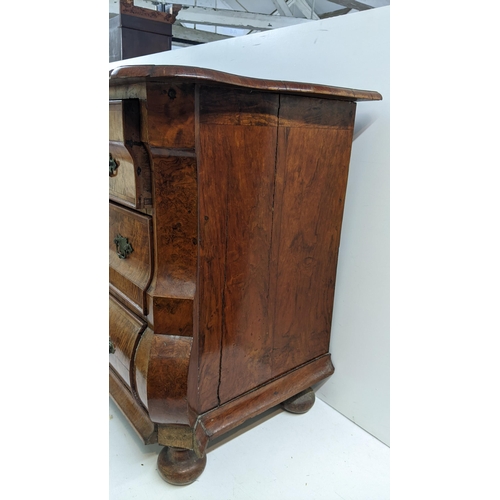 168 - A 18th century continental burr walnut bombe chest of three graduating drawers, having marquetry inl... 