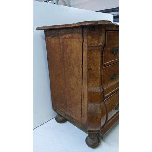 168 - A 18th century continental burr walnut bombe chest of three graduating drawers, having marquetry inl... 