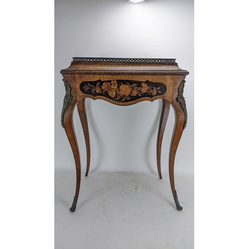 170 - A pair of 19th century French kingwood jardiniere tables, each having a pierced gallery top with a m... 