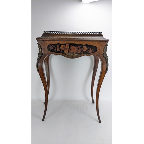 170 - A pair of 19th century French kingwood jardiniere tables, each having a pierced gallery top with a m... 