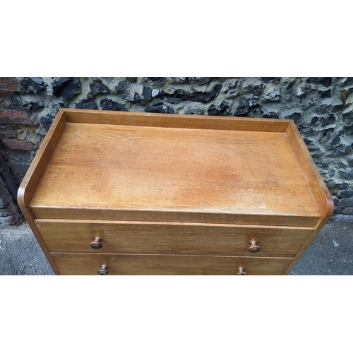 194 - A 1940's Gordon Russell of Broadway, oak three drawer straight front chest of drawers, having a thre... 