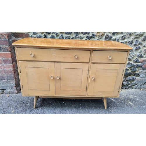 195 - A 1960s Ercol blonde elm and beech sideboard model 351, designed by Lucian Ercolani, having two draw... 