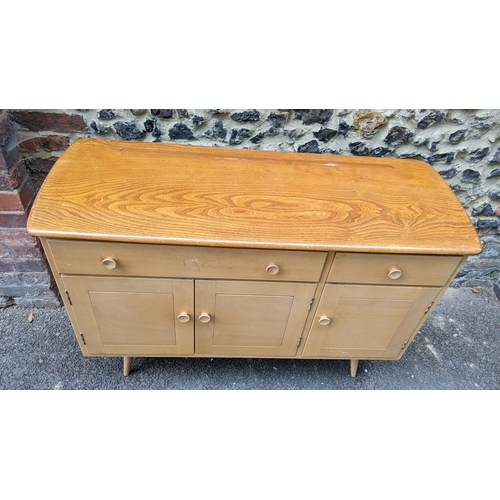 195 - A 1960s Ercol blonde elm and beech sideboard model 351, designed by Lucian Ercolani, having two draw... 