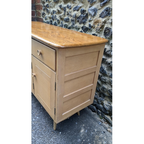 195 - A 1960s Ercol blonde elm and beech sideboard model 351, designed by Lucian Ercolani, having two draw... 