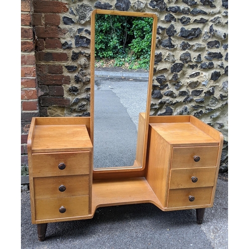 196 - A 1930's Gordon Russell of Broadway, oak dressing table, having a three-quarter gallery surrounding ... 