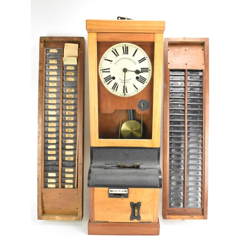 90A - An early/mid 20th century National Time Recorder clocking in clock, in a stained beech case, the cir... 