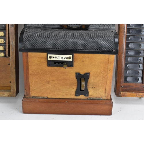 90A - An early/mid 20th century National Time Recorder clocking in clock, in a stained beech case, the cir... 