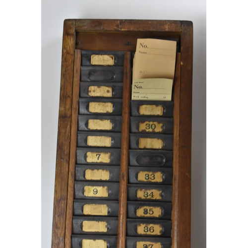 90A - An early/mid 20th century National Time Recorder clocking in clock, in a stained beech case, the cir... 