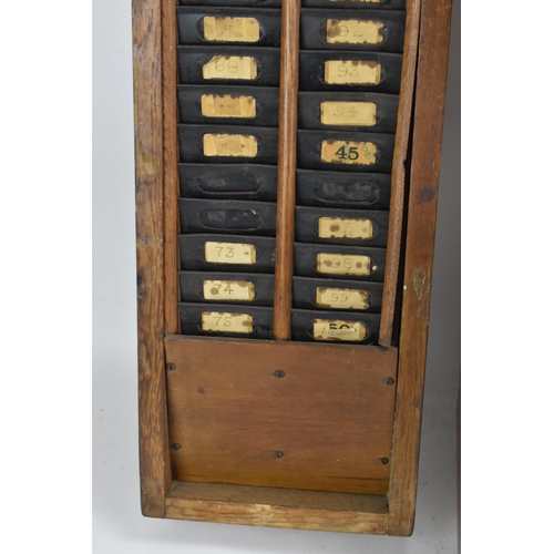 90A - An early/mid 20th century National Time Recorder clocking in clock, in a stained beech case, the cir... 