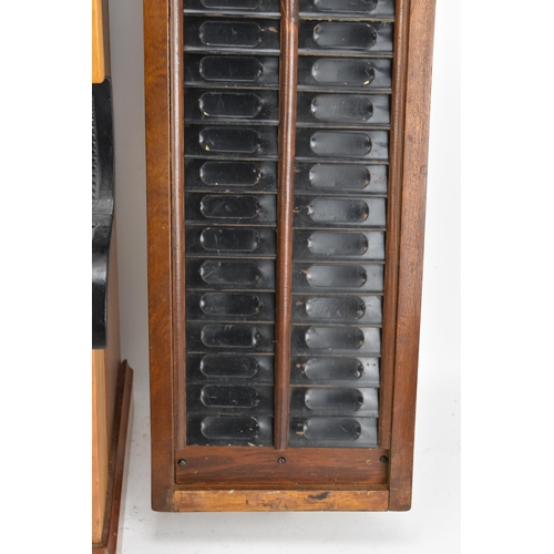 90A - An early/mid 20th century National Time Recorder clocking in clock, in a stained beech case, the cir... 