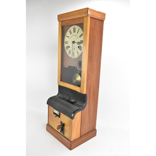 90A - An early/mid 20th century National Time Recorder clocking in clock, in a stained beech case, the cir... 