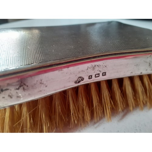 58 - Three silver backed clothes brushes to include a pair of mid 20th Century Adie Brothers Ltd brushes.... 