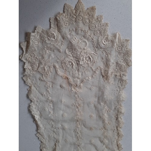 59 - An Edwardian cream lace veil having a button mesh ground with floral embroidered sprays, 24cm wide x... 