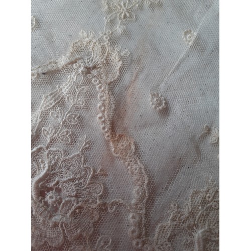 59 - An Edwardian cream lace veil having a button mesh ground with floral embroidered sprays, 24cm wide x... 