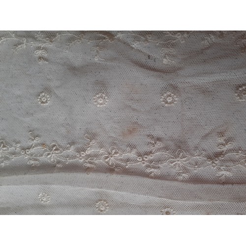 59 - An Edwardian cream lace veil having a button mesh ground with floral embroidered sprays, 24cm wide x... 