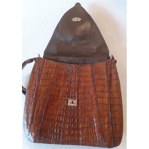 62 - A mid 20th Century brown crocodile skin bag with baby crocodile head and feet to the flap. Location:... 