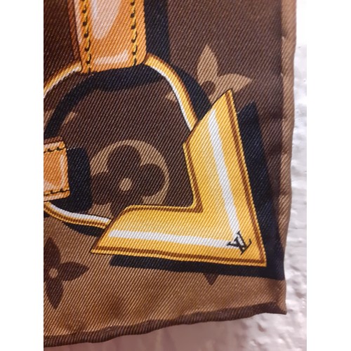 2 - Louis Vuitton- A brown LV monogram silk scarf with belt and chain design having hand rolled edges to... 