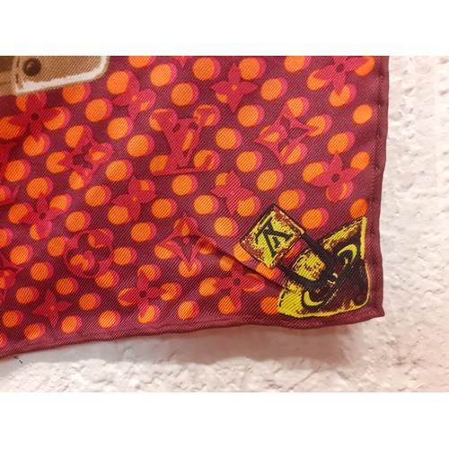 4 - Louis Vuitton-A silk monogram 'Keepall Wallpaper' neckerchief having a red, pink and orange ground w... 