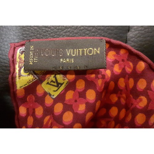 4 - Louis Vuitton-A silk monogram 'Keepall Wallpaper' neckerchief having a red, pink and orange ground w... 