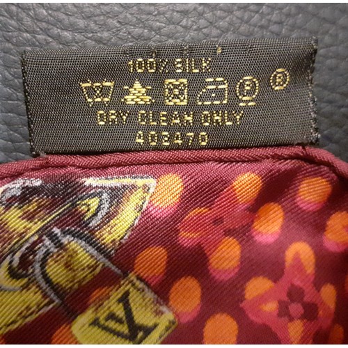 4 - Louis Vuitton-A silk monogram 'Keepall Wallpaper' neckerchief having a red, pink and orange ground w... 