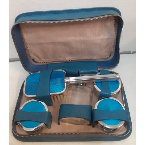 66 - A mid 20th Century chrome and blue enamelled vanity set in blue travel case with 'Made in England' i... 