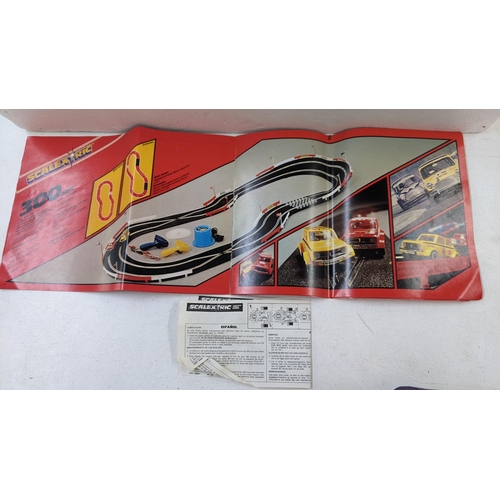 103 - A Scalextric and track to include two Mini Clubman's 1275 GT's one red and the other yellow, in the ... 