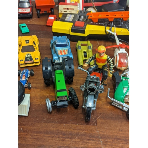 108 - A mixed lot of toys to include a Kingsman Robot Machine, a Corgi Ford Mustang and a Matchbox superki... 