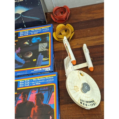 110 - A Dinky Model of U.S.S Enterprise NCC .1701 1976 and six reel to reel films to include Star Wars Sup... 