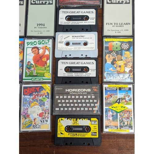 111 - Spectrum 48K/128k cassette games to include Scalextric, Yie Ar Kung Fu 2, Road Runner and Wile E Coy... 