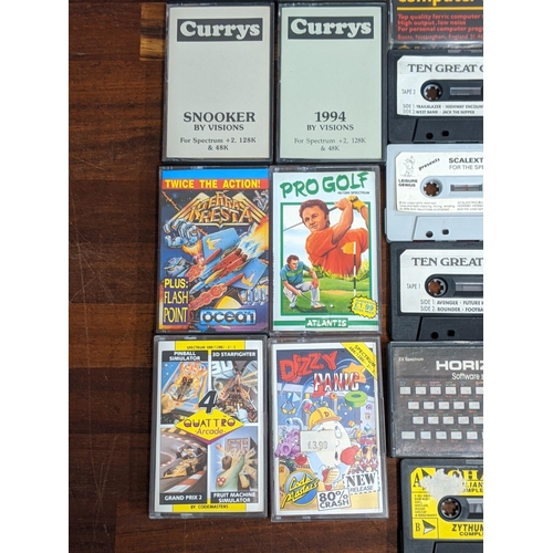 111 - Spectrum 48K/128k cassette games to include Scalextric, Yie Ar Kung Fu 2, Road Runner and Wile E Coy... 