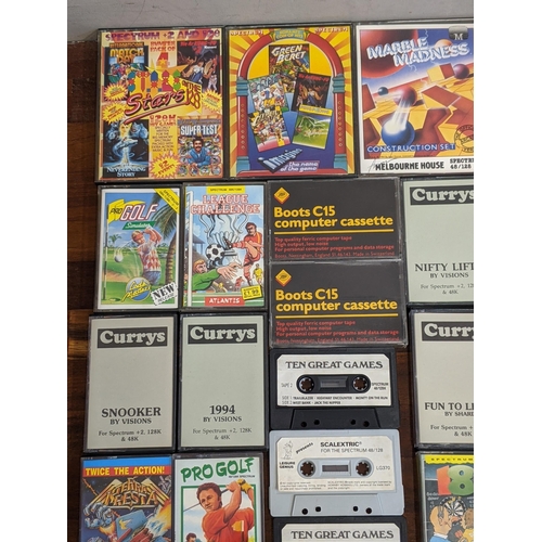 111 - Spectrum 48K/128k cassette games to include Scalextric, Yie Ar Kung Fu 2, Road Runner and Wile E Coy... 