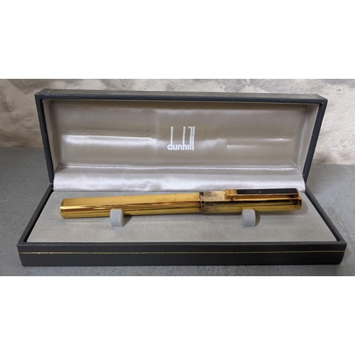 16 - A Dunhill gold coloured fountain pen with a 14ct  gold nib, boxed
Location:CAB2
If there is no condi... 