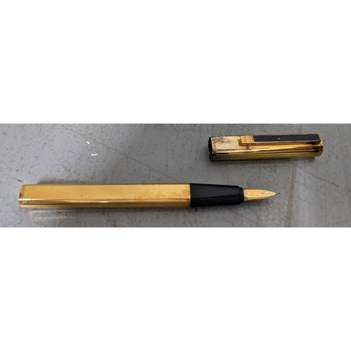 16 - A Dunhill gold coloured fountain pen with a 14ct  gold nib, boxed
Location:CAB2
If there is no condi... 