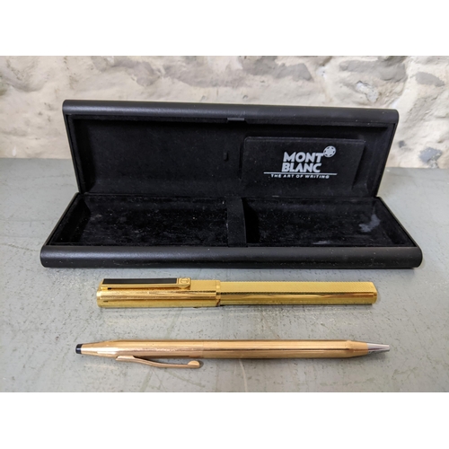 18 - A Dunhill gold coloured fountain pen with an 14t gold nib and a cross gold coloured ball point house... 