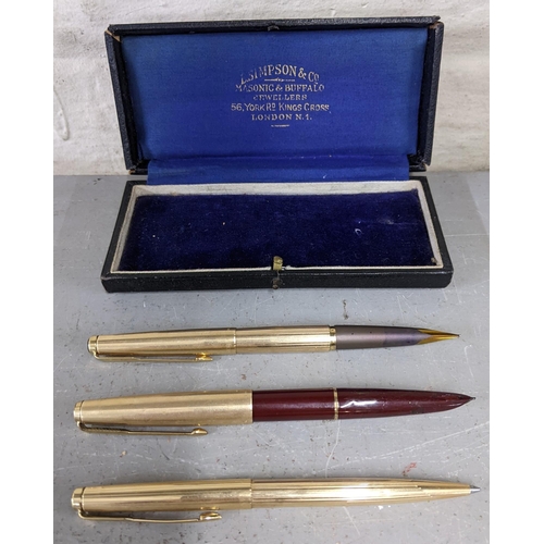 2 - Three gold coloured Parker pens in a vintage box to include two fountain pens and a roller ball pen,... 