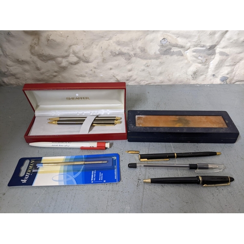 20 - Mixed pens to include a boxed Waterman black enamelled ballpoint pen A/F with ballpoint refill, A Sh... 