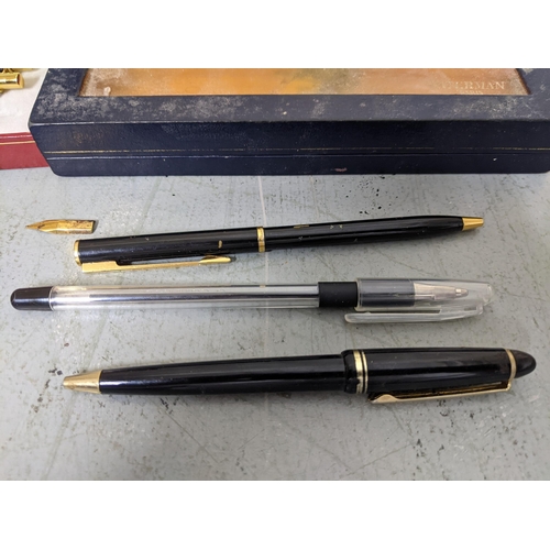 20 - Mixed pens to include a boxed Waterman black enamelled ballpoint pen A/F with ballpoint refill, A Sh... 