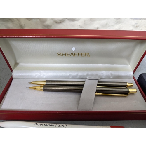 20 - Mixed pens to include a boxed Waterman black enamelled ballpoint pen A/F with ballpoint refill, A Sh... 