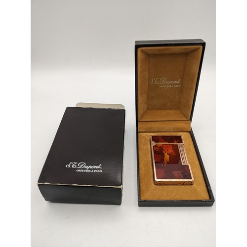 23 - A Dupont red marbled lacquered cigarette lighter in it original case and box
Location:CAB3
If there ... 