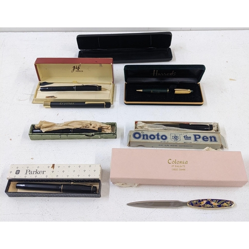 26 - Mixed writing equipment to include a boxed De La Rue Onoto fountain pen, a letter opener with an ena... 