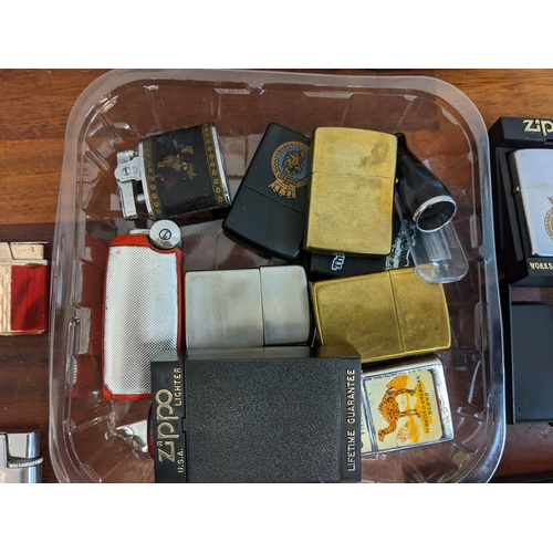 27 - A collection of cigarette lighters and smoking equipment to include various Zippos, Ronson Colibries... 