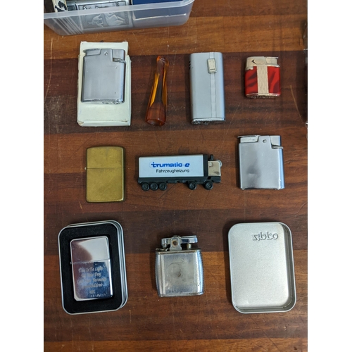 27 - A collection of cigarette lighters and smoking equipment to include various Zippos, Ronson Colibries... 